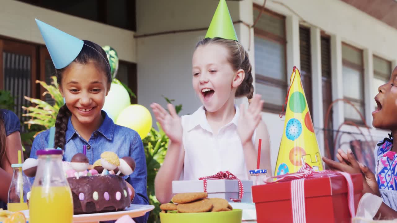 Group of kids celebrating their friend birthday 4k