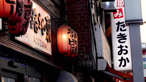 japanese lanterns glowing outside a traditional establishment