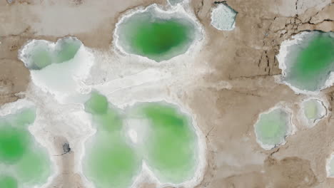 beautiful sinkholes on the shore of the dead sea near ein gedi beach