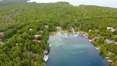 shipwreck at bottom of inlet surrounded by resort houses