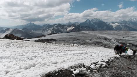 mountain climbers on snowy summit