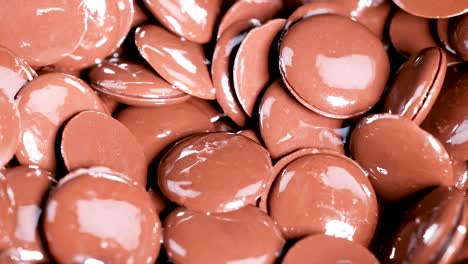 close-up view of chocolate buttons moving