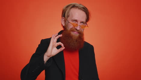 man looking approvingly, showing ok approve feedback gesture like sign positive something good