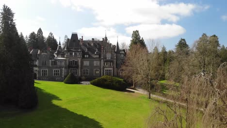 fairy tale castle in a beautiful green park, airshot