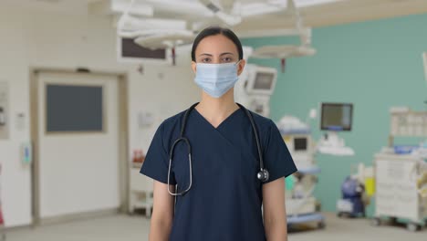 Indian-female-doctor-standing-with-mask-on