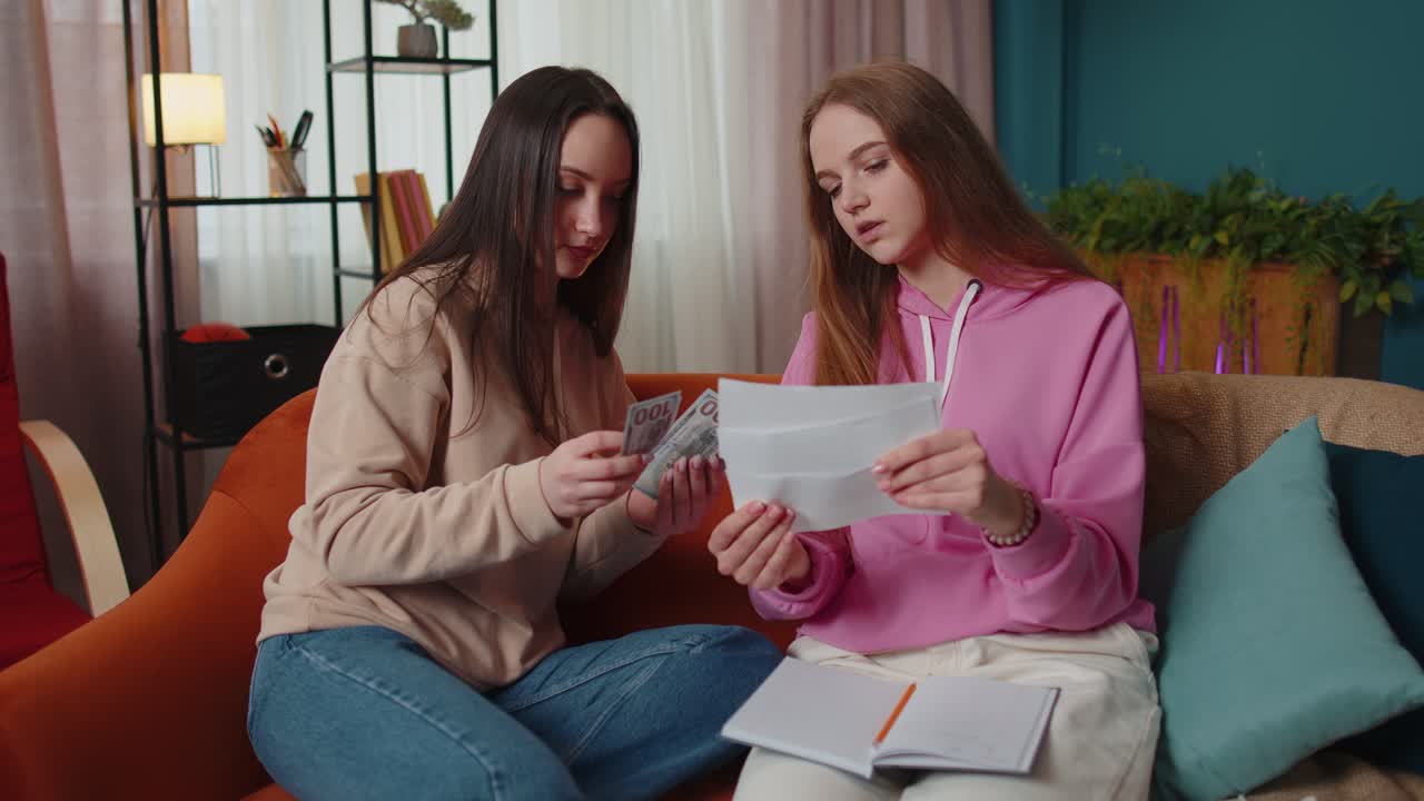 Girls siblings checking household payments calculating bills feels panic about bankruptcy problem