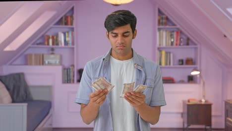 Sad-Indian-man-counting-money