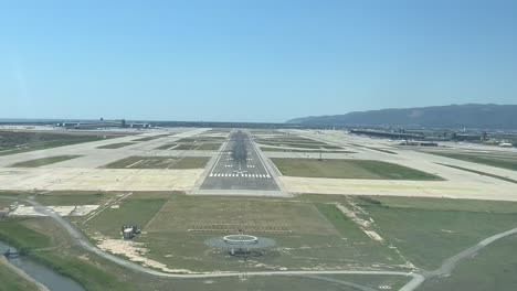 real time landing at barcelona airport shot from a plane cockpit in a bright spring sunny morning