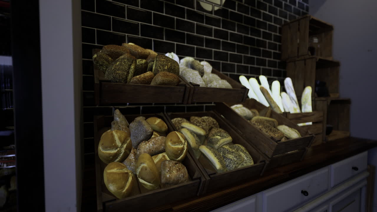 Freshly baked artisan breads displayed in a cozy bakery setting
