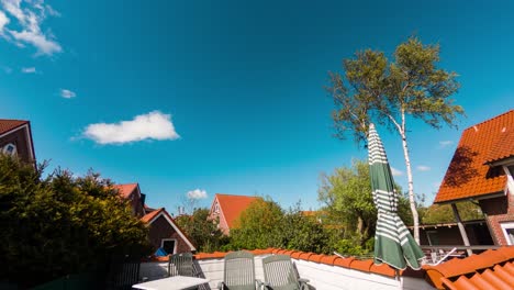 relaxing sunny day with clouds passing on a blue bright sky