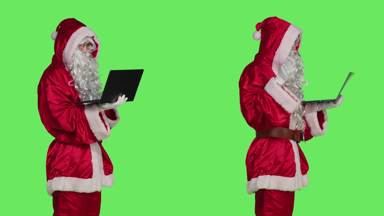 Santa Claus Using Laptop on Green Screen