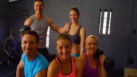 group of people sitting with fitness equipment