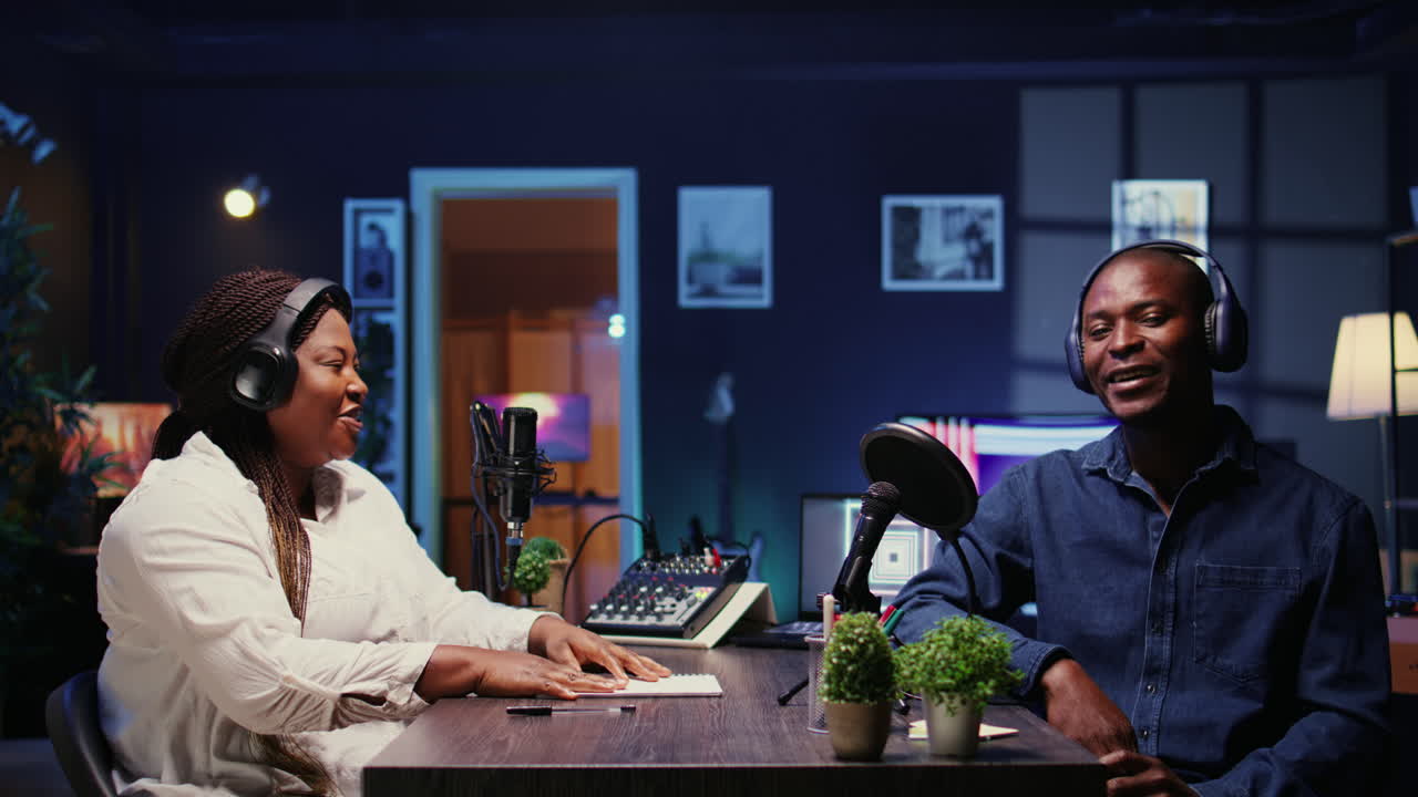 Man laughing during comedy focused podcast, entertained by funny presenter