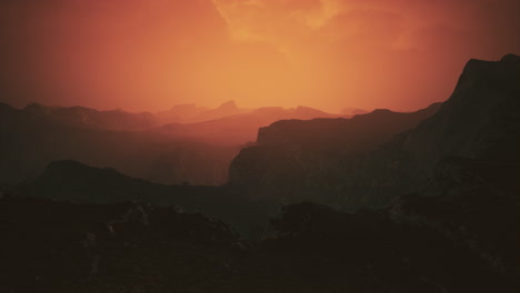 dramatic-sky-over-rocky-mountains-at-sunset