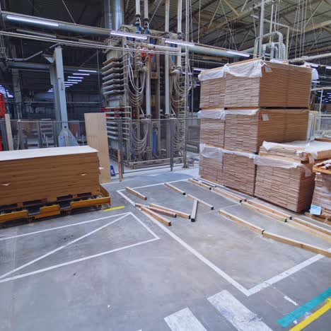 industrial woodworking factory floor with production line and workers