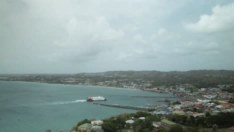 tt spirit inter island ferry aerial slow motion view docking at the scarborough port on the island of tobago