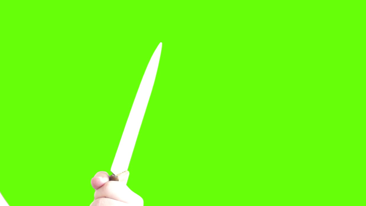 Hand Holding a Knife on Green Screen