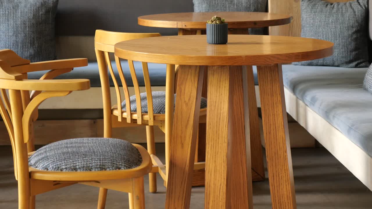 Modern Cafe Interior with Empty Wooden Tables and Chairs