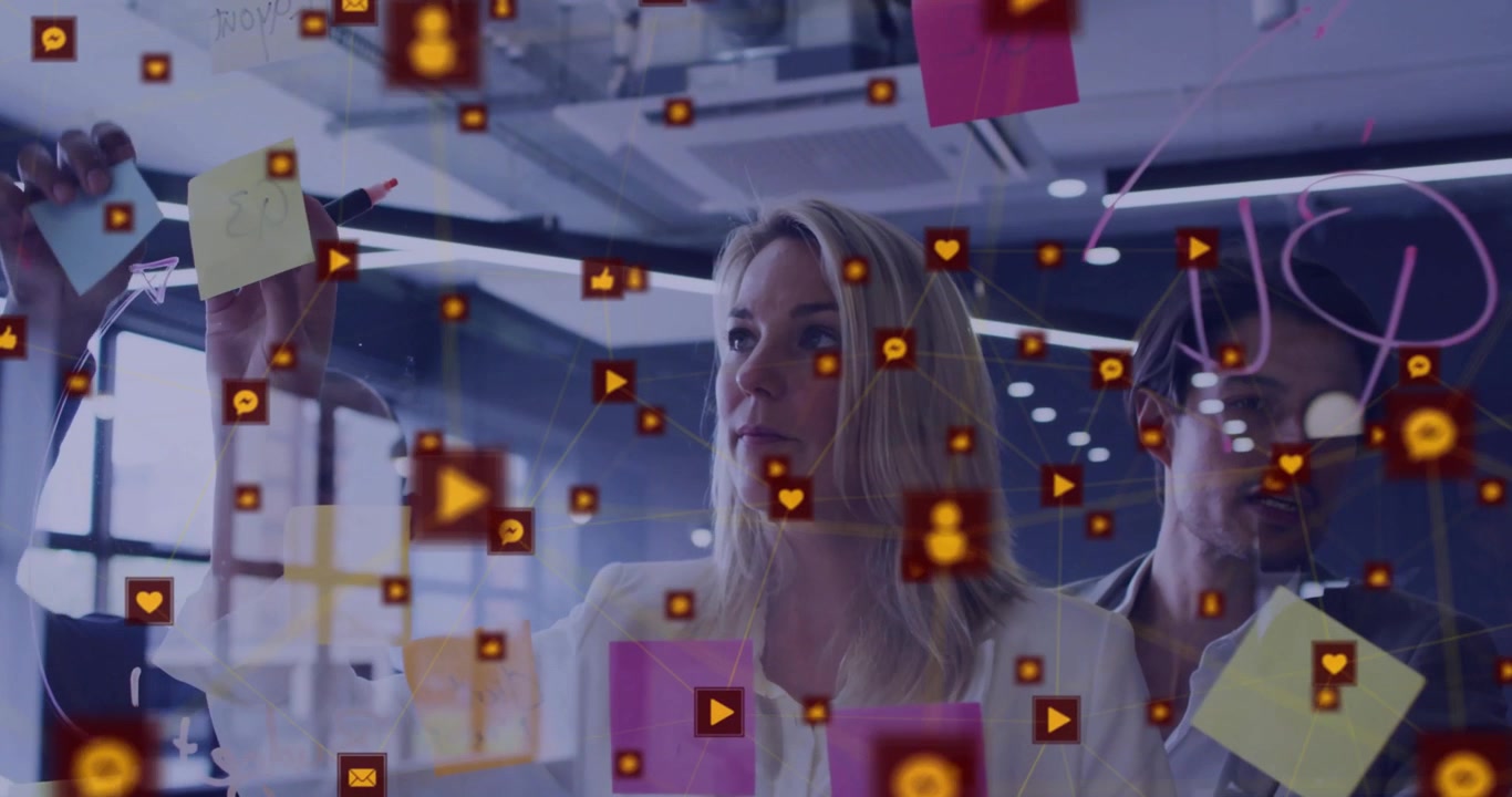 Animation of social media network over diverse male and female colleague brainstorming at office