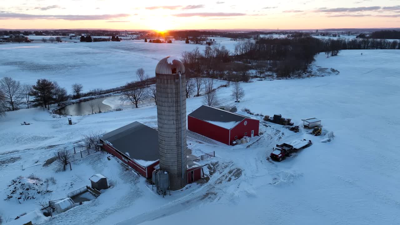 Large tall silo and red barn