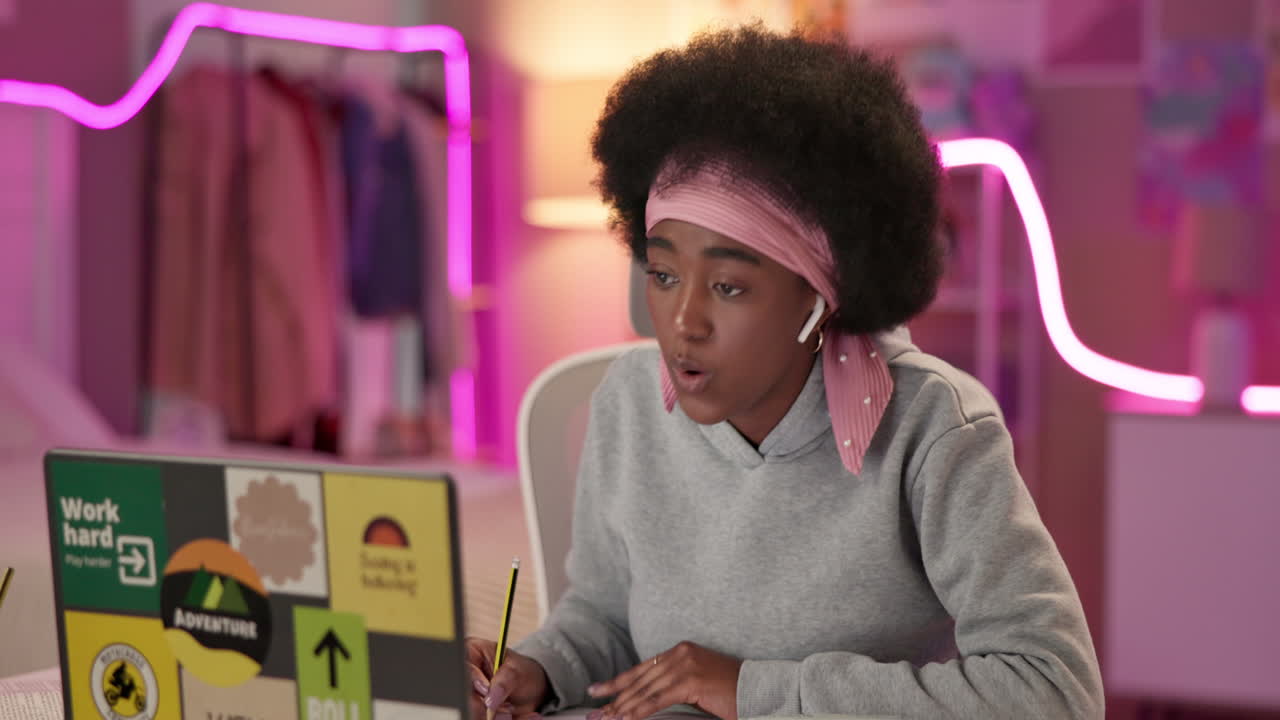 Young woman studying at her desk