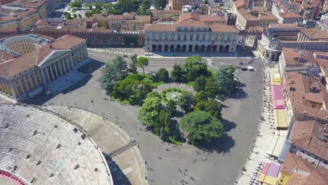 aerial panoramic view of arena di verona, italy. the drone flies over bra square and takes pictures of people walking. a view of the arena and the city opens. 4k vieo.
