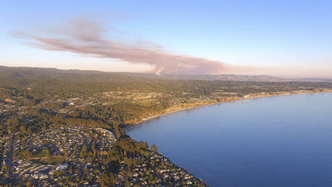 aerial view of smoke from brush fires between watsonville and morgan hill, california as seen from the bay