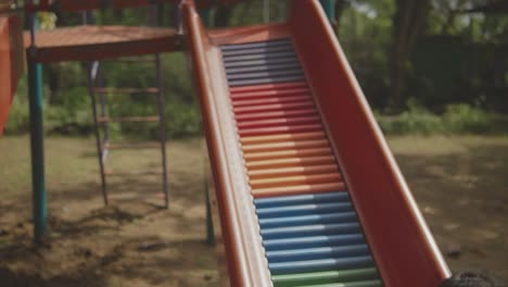 exciting slide adventure with a young boy wearing a santa claus face mask on a tropical beach