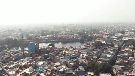 gulab sagar lake reservoir amidst urban landscape of blue city of jodhpur, rajasthan, india - aerial panoramic shot