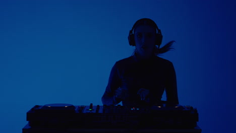 woman dj mixing music