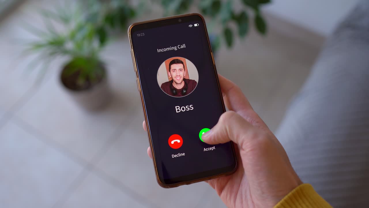 Person Hesitating To Answer Call From Boss. - closeup shot