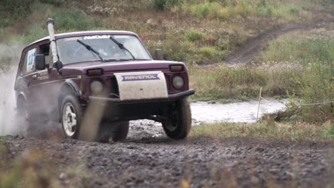 off-road vehicle navigating a muddy trail.