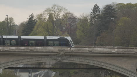 Tram-driving-over-Adolphe-Bridge-in-Luxembourg