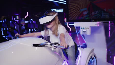 girl playing vr motorcycle simulator