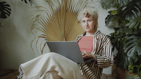 Portrait-of-Girl-with-Laptop-in-Indoor-Home-Garden