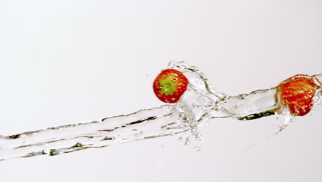 strawberries moving through stream of water