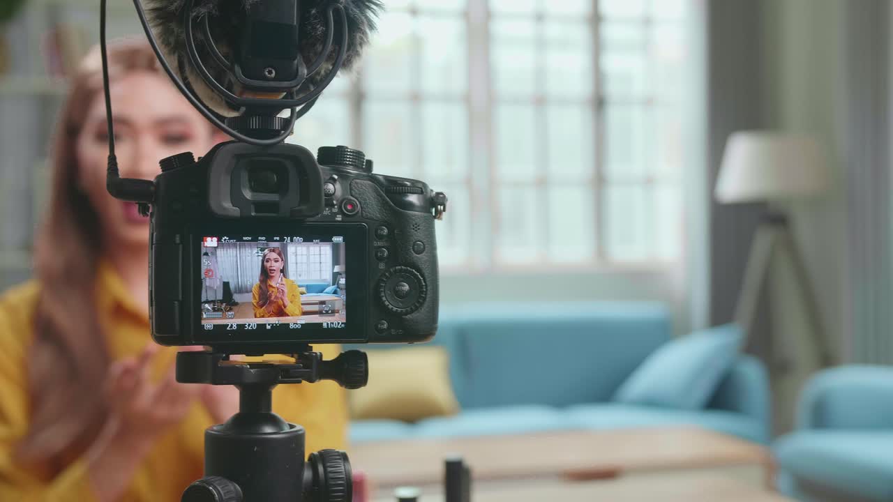 Display Of Camera Recording Video Blog Tells How To Be Beautiful In Home Studio. Influencer Young Transgender Woman Blogger Talks About Makeup