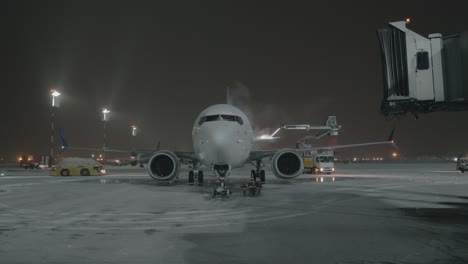 an airplane on a courtyard being washed