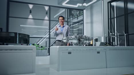 engineer presenting jet engine in modern laboratory