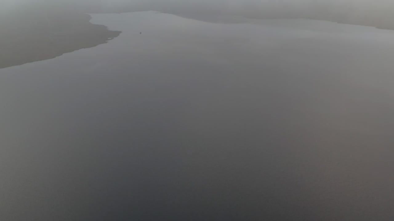 Aerial view of Spelga Dam on misty morning