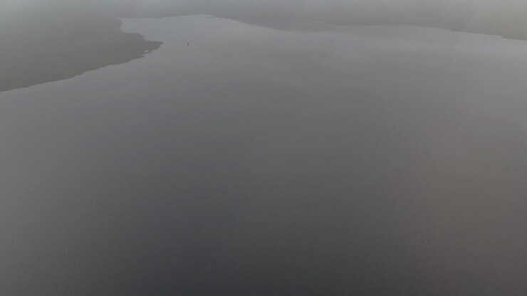 Aerial view of Spelga Dam on misty morning