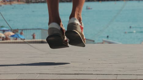 Person walking and jumping on a beach