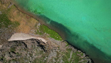 Aerial-drone-cinematic-high-altitude-snow-melt-Ice-Lake-Basin-Island-Lake-trail-unreal-blue-water-hike-Silverton-Ouray-Red-Mountain-Pass-Colorado-dreamy-heavenly-Rockies-scene-summerlooking-down