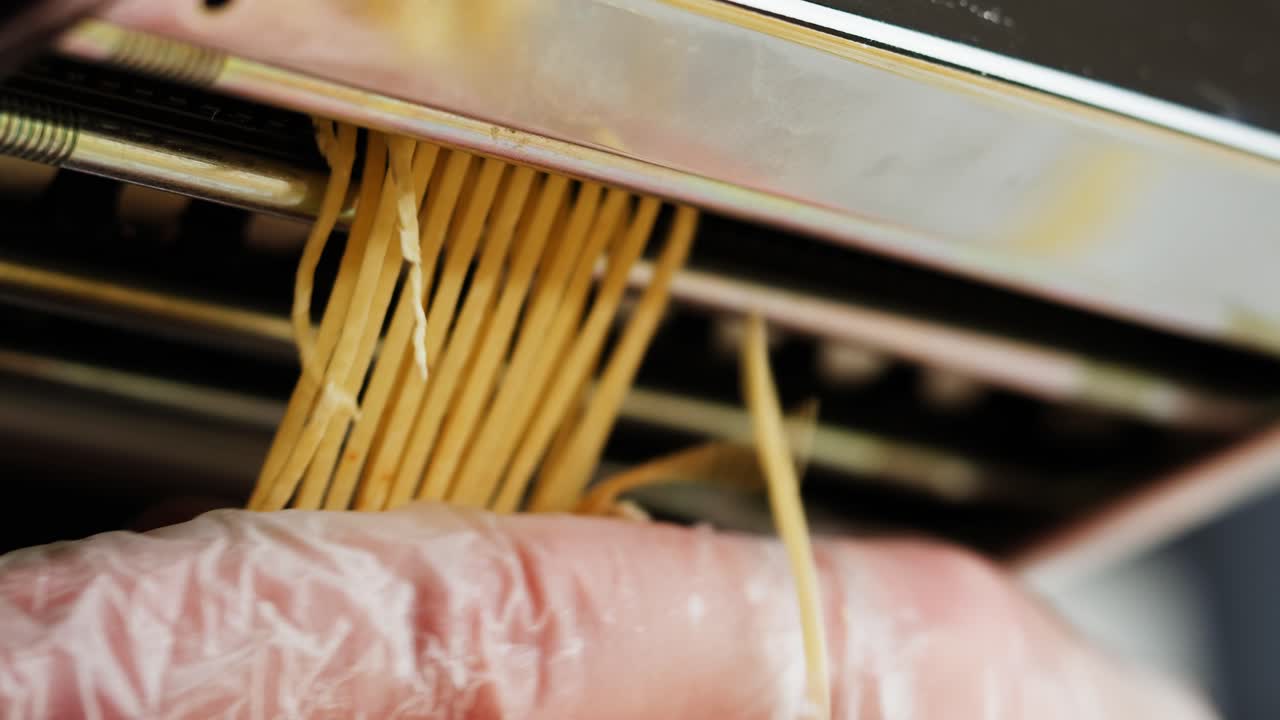 Close-up of Fresh Homemade Pasta Being Made with a Machine