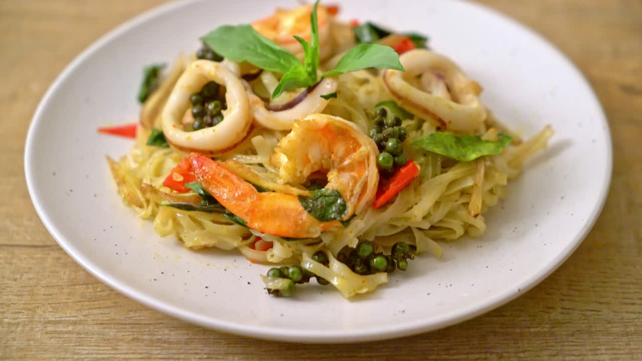stir fried spicy noodles with sea food (Pad Cha Talay) - Thai food style