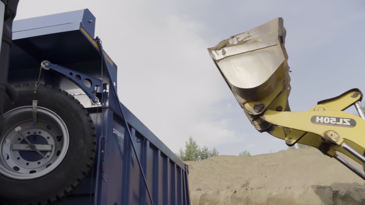 Excavator Loading a Dump Truck
