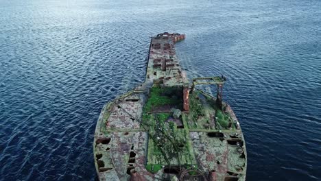 aerial footage of the wreck of juniata, an old abandoned ship at inganess bay on the mainland of orkney