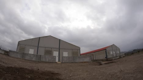 buildings on industrial farm under clouds