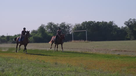 two women riding horses