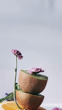 creative kiwi and flower arrangement
